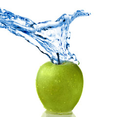 fresh water splash on green apple isolated on white
