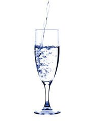 Glass of pouring water