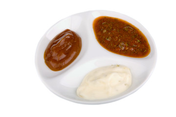 Assortment of sauces over white background