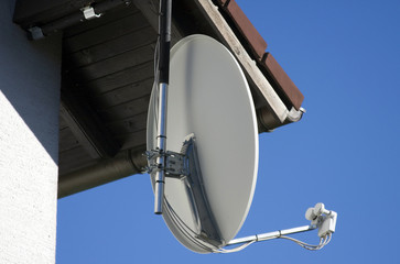 TV satellite dish on a house.