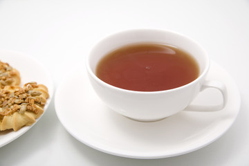 cup of tea and cookies isolated