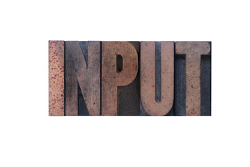 the word 'input' in old ink-stained wood type