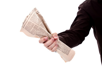 hand holding a newspaper