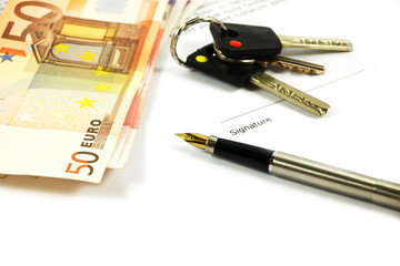 Bank notes, keys and a gold-nibbed pen