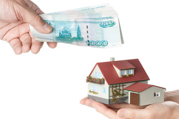 Hands with money and miniature house