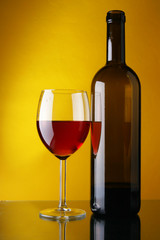 Wineglass and bottle of red wine