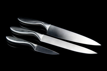 Obraz premium 3 kitchen knives on a black background