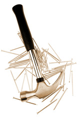 Hammer and nails on white