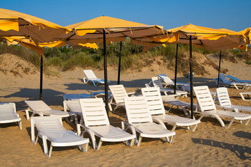 Yellow parasols and chaise-longue