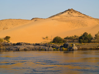 Sand dune view from a boat on Nile river. Egypt series