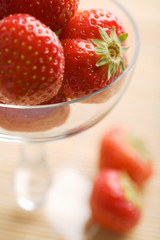 ripe strawberries in glass bowl