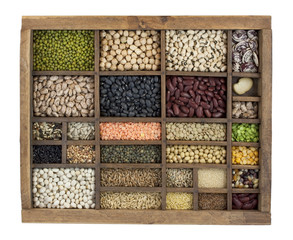 variety of beans, grains and seeds in vintage typesetter box