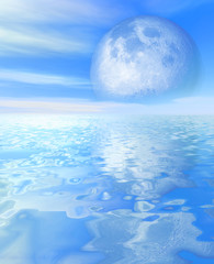 The blue sky and big moon above sea
