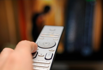 Hand with TV remote control