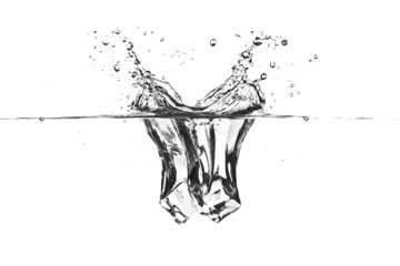 Ice cube dropped into water