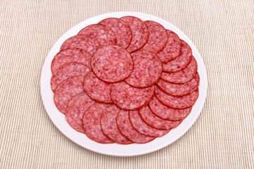 Smoked sausage on the plate.