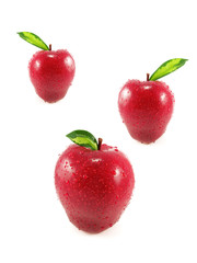 three fresh red apples on white