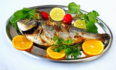 Cooked fish with lemons