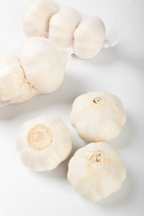 a group of garlic heads close up