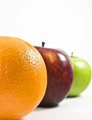 three colorful juicy fruits in a row