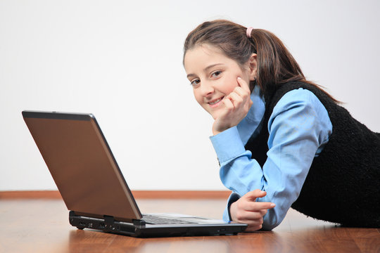 School girl with her laptop computer