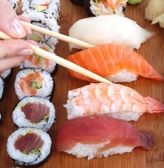 sushi and chopsticks close-up, food background
