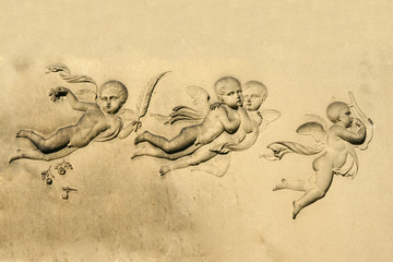 little angels on a grave stone