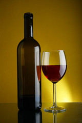 Wineglass and bottle of red