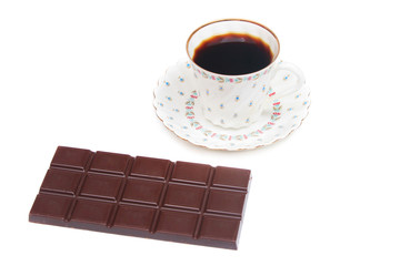 Cup of coffee and bar of chocolate.