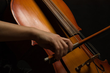 Close up musician hands with cello