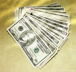 close up shot of 10 dollar on yellow background