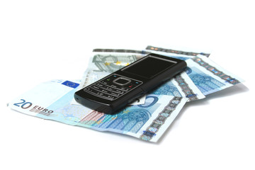 Mobile phone and euro money isolated on white background