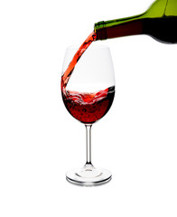Fototapeta na wymiar Red wine being poured into glass