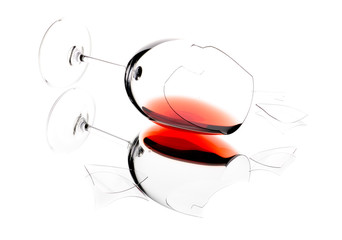 Glass of wine, broken on the mirror. Isolated on white