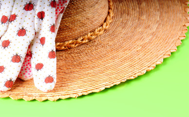 straw hat and gardening gloves