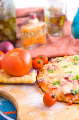 cheese and tomato pizza with rocket