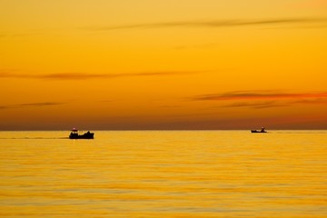 Naklejka premium two boats on the sea