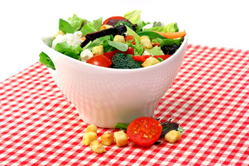 Mixed salad in a white bowl