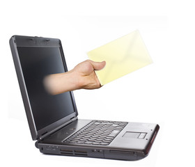 hand with letter coming out of laptop