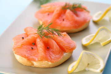 Smoked salmon on bagel with fresh black pepper.