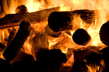 Logs provide fuel for a bonfire
