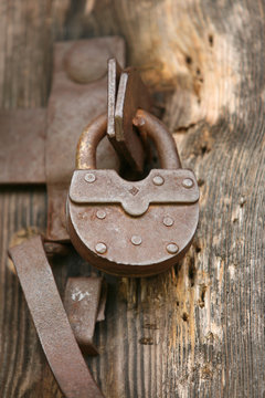 Vintage padlock on an old door