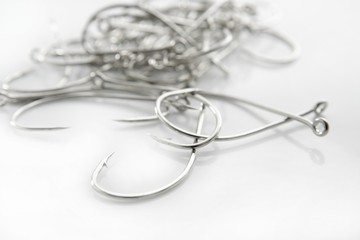 fishing hooks over white background