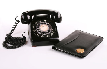 Old fashioned phone and notepad