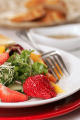 Beautiful salad with strawberries and sprouts