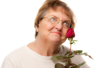 Thoughtful Senior Woman with Red Rose.