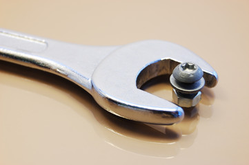 Wrong tool: big wrench with little nut and screw
