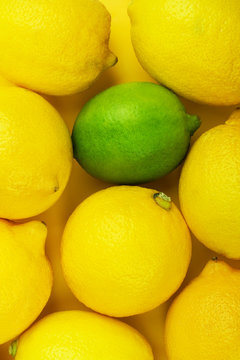 Fresh lemons and single lime