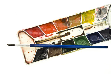 dirty watercolor paints set with brush after using