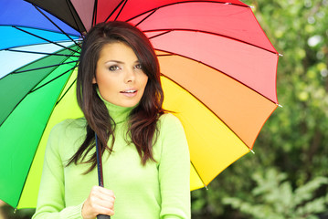 Woman with umbrella in park